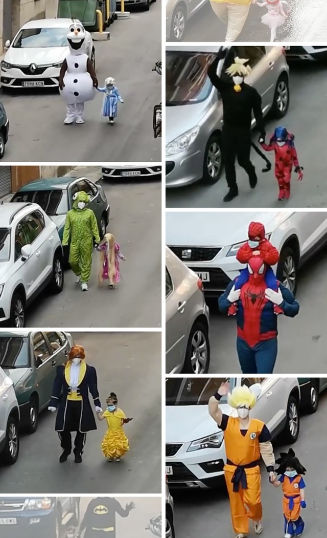 Pai e filha usam fantasias para levar lixo durante o isolamento na Espanha